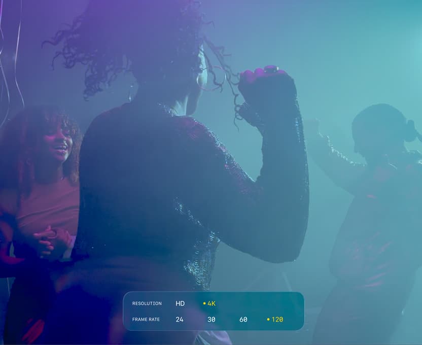A screen of people dancing in low-light filming conditions shows the capabilities of 4K 120 fps Dolby Vision