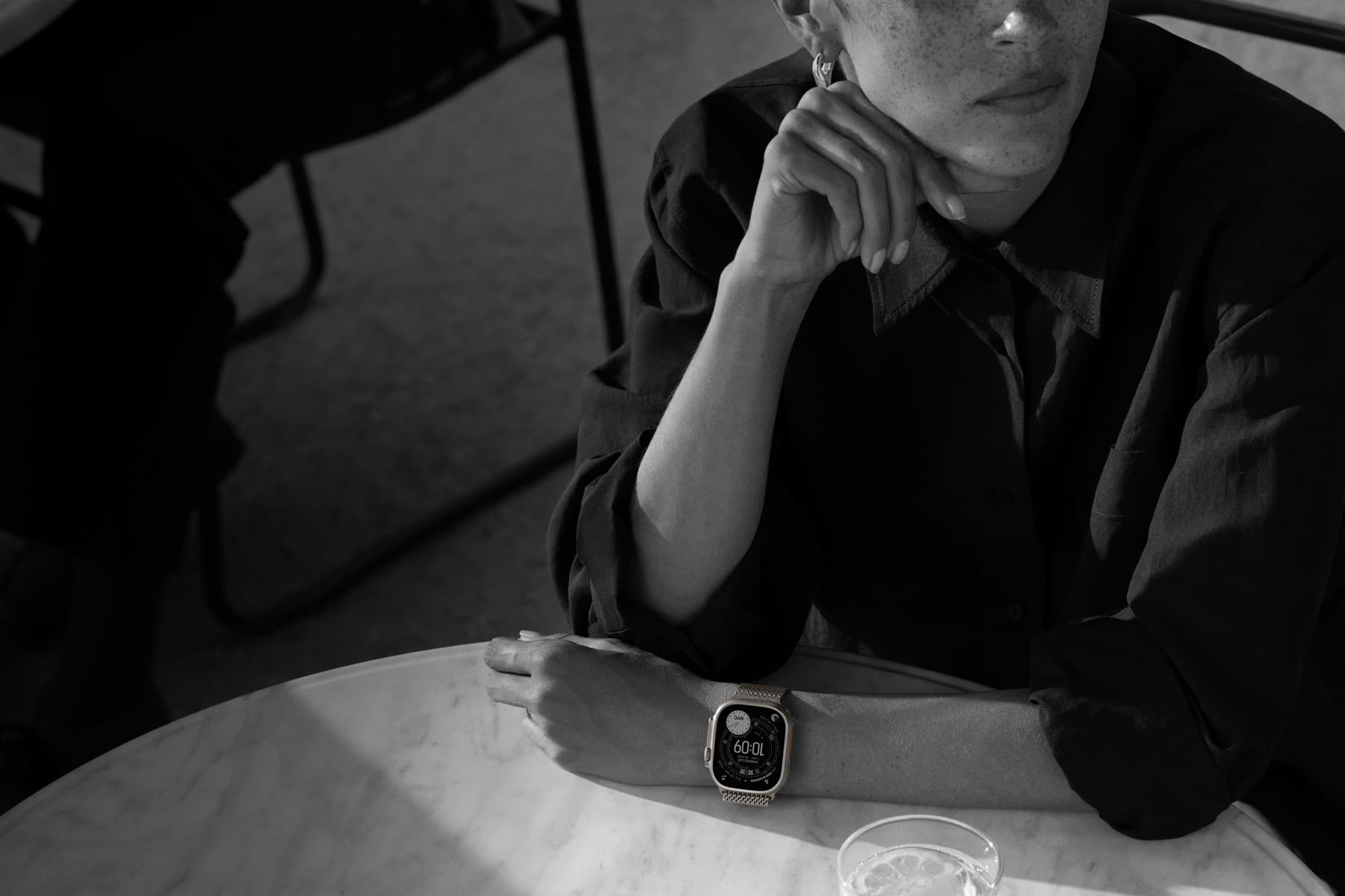 A person wears Apple Watch Ultra 3 while out to dinner
